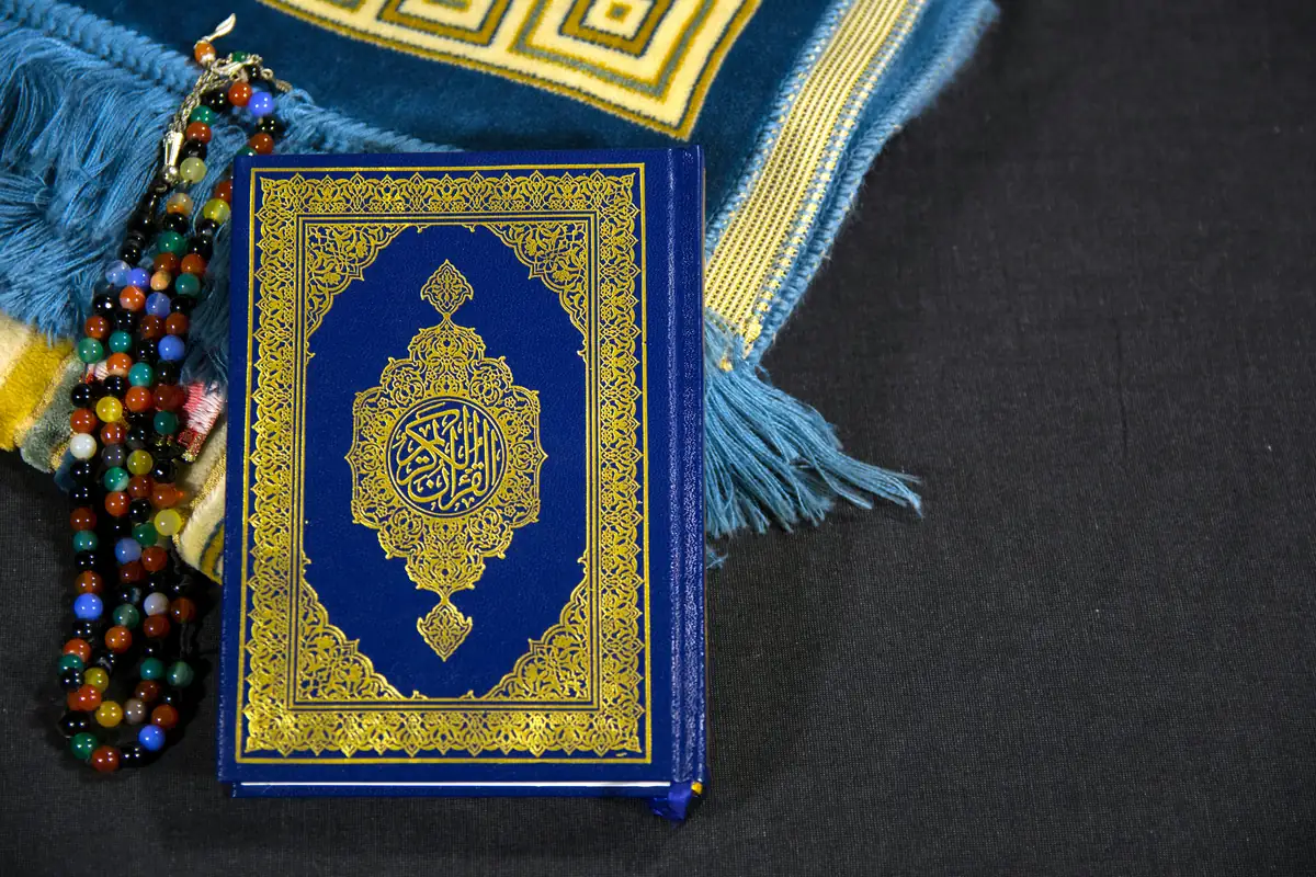 Quran with prayer mat — Islamic estate planning