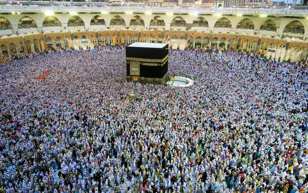 Aerial view of the Kaaba at Masjid al-Haram surrounded by hundreds of thousands of pilgrims in white Ihram during Hajj