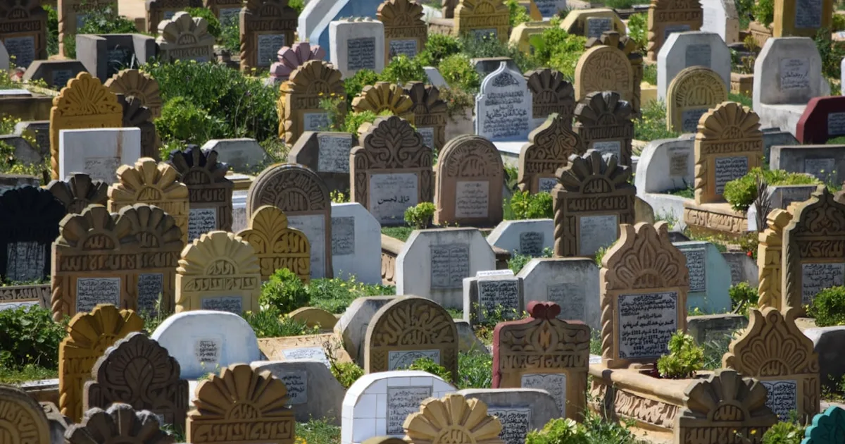 A traditional Islamic cemetery with Arabic-inscribed headstones